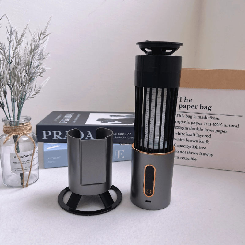 Portable mosquito zapper lamp with detachable parts, USB-C charging, and modern grey design. Ideal for bedrooms, desks, or travel. Eco-friendly and chemical-free insect killer.