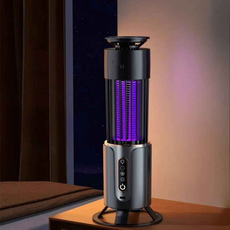 Portable electric mosquito killer lamp on nightstand, using UV light to attract and eliminate flying insects. Silent, chemical-free solution for bedrooms.