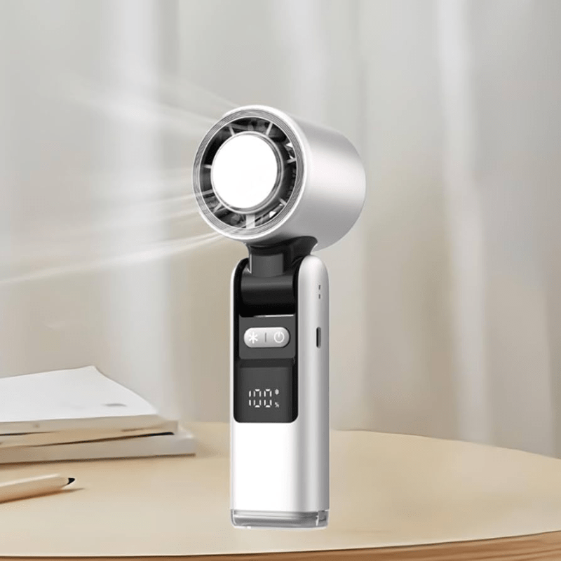 Techynook white handheld fan in use on a desk, showing airflow and battery level on LED screen