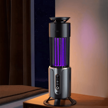Portable electric mosquito killer lamp on nightstand, using UV light to attract and eliminate flying insects. Silent, chemical-free solution for bedrooms.